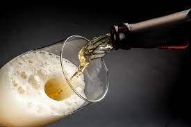 Pouring beer from bottle into a glass